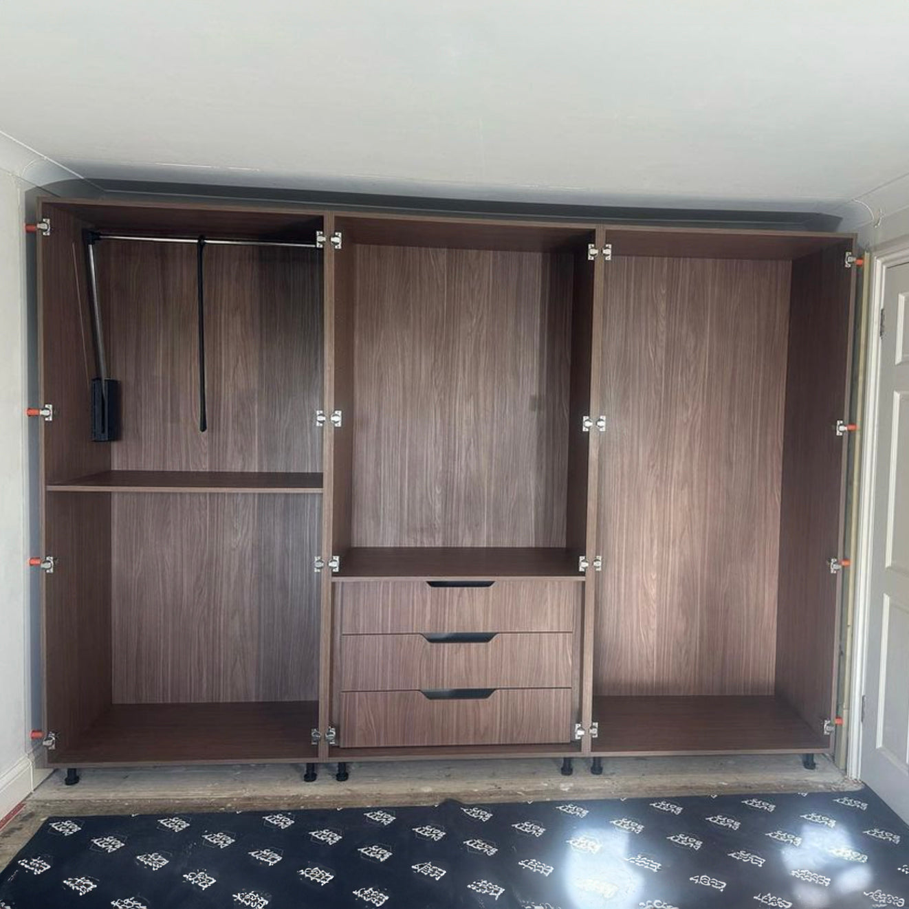 Large Wardrobe secured to walls with 8 Space-Plugs